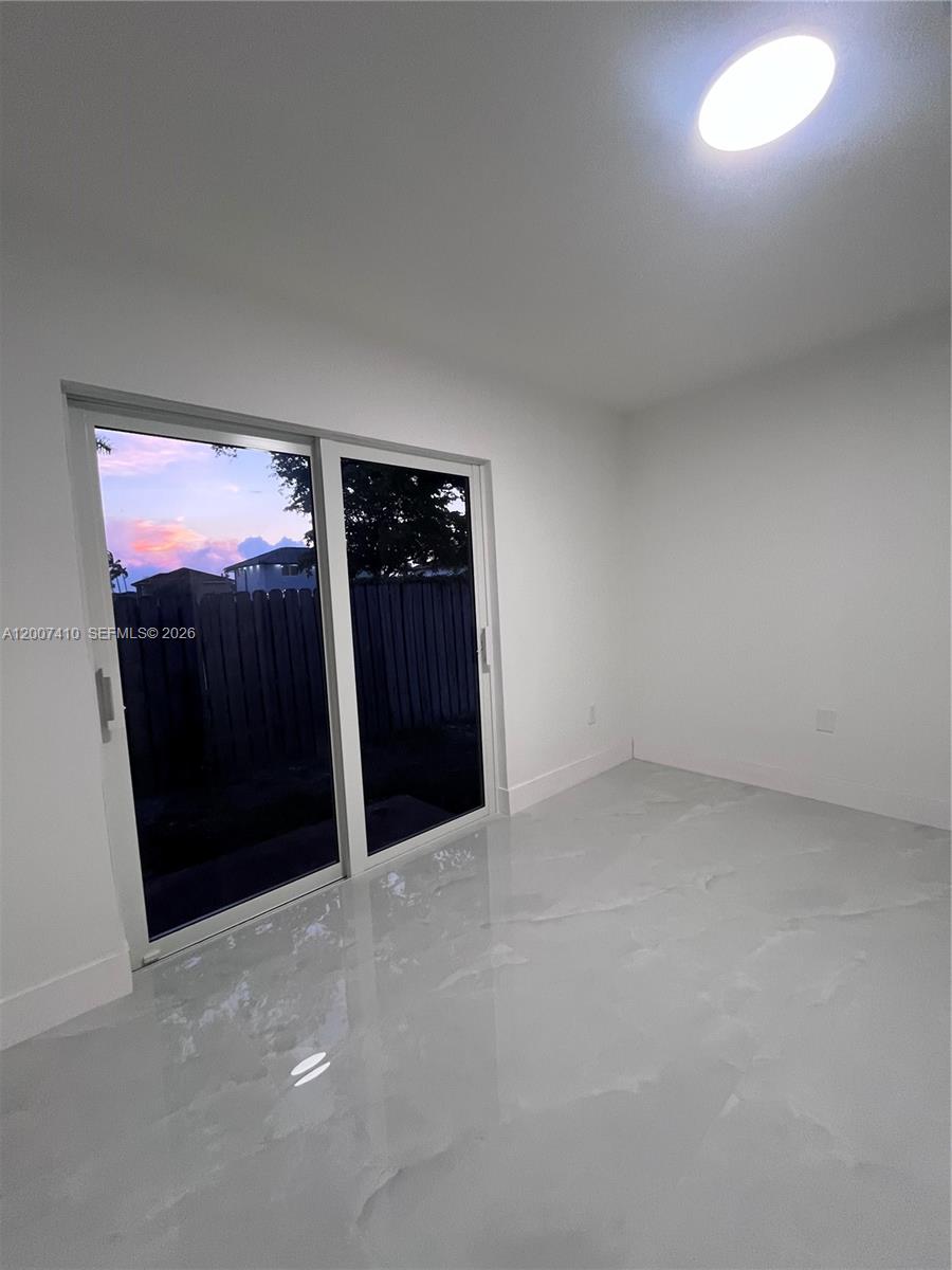 10058 Southwest 156th Court Miami, FL 33196 - Photo 5 of 13 a view of empty room