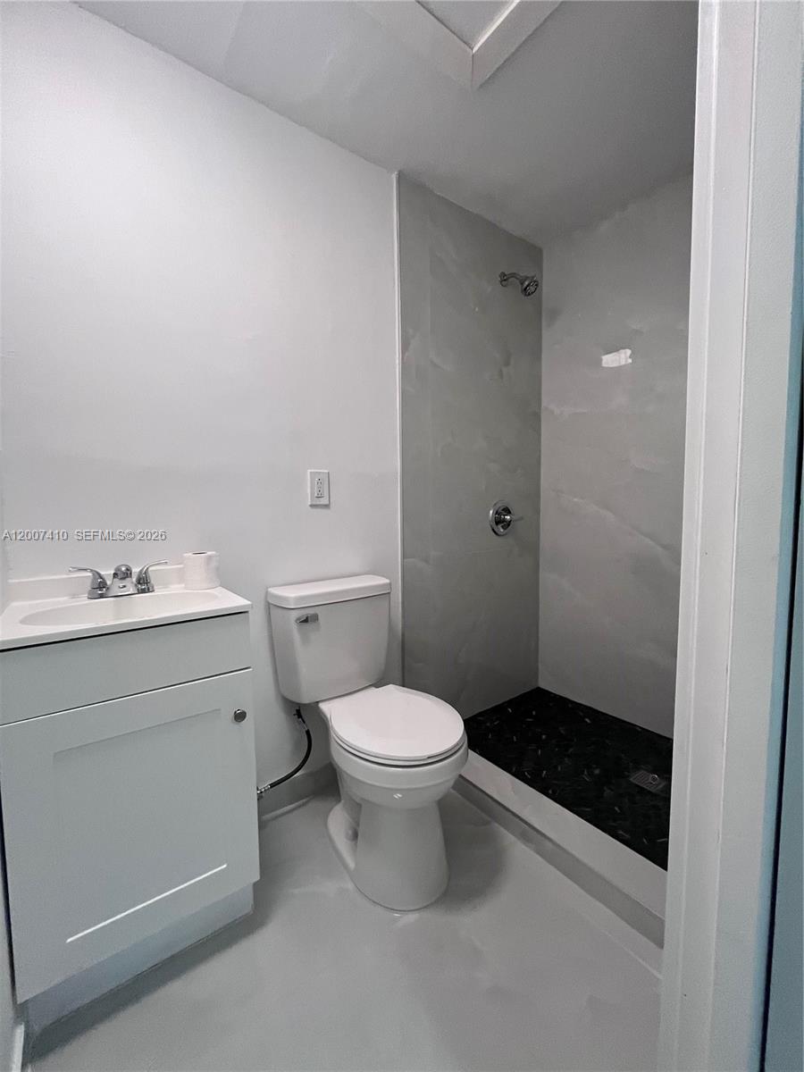 10058 Southwest 156th Court Miami, FL 33196 - Photo 7 of 13 a bathroom with a sink toilet and shower