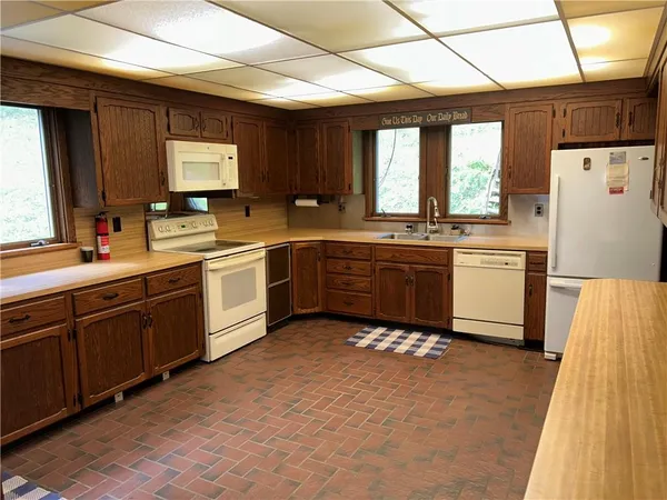 a kitchen with a sink cabinets and window