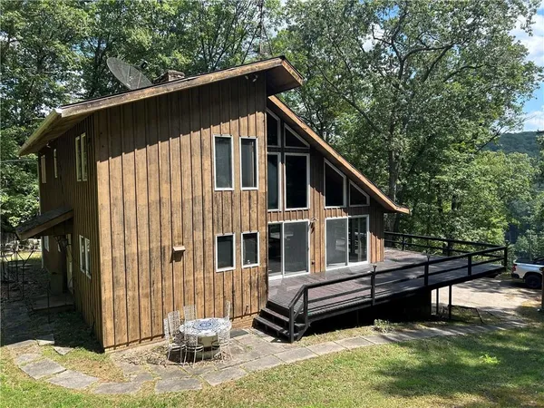 a house view with a backyard space