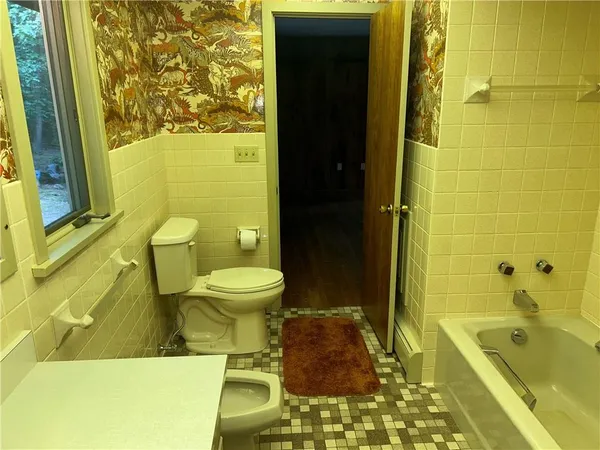 a view of a balcony with furniture