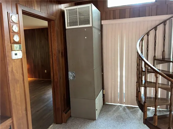 a white toilet sitting next to a bath tub