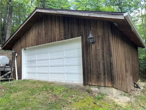 a view of a house with a yard and sitting area