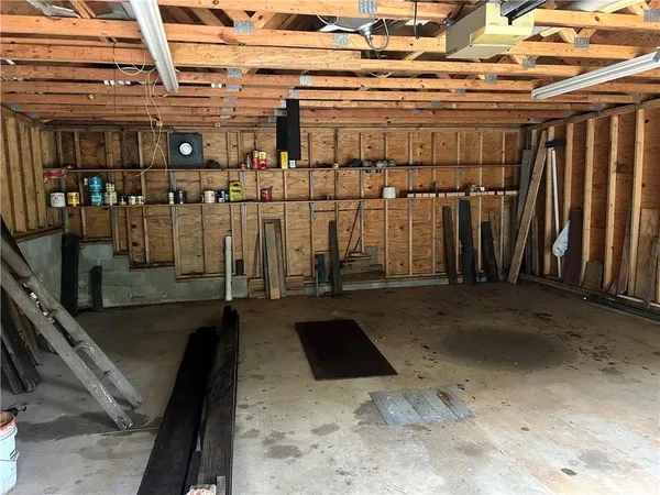 a backyard of a house with yard barbeque oven and outdoor seating