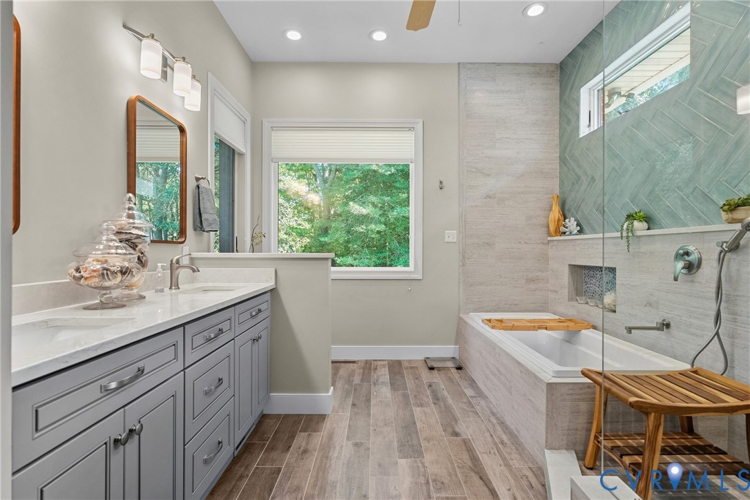 447 Tranquility Road Reedville, VA 22539 - Photo 18 of 82 Dual vanity with gray cabinetry and white countert