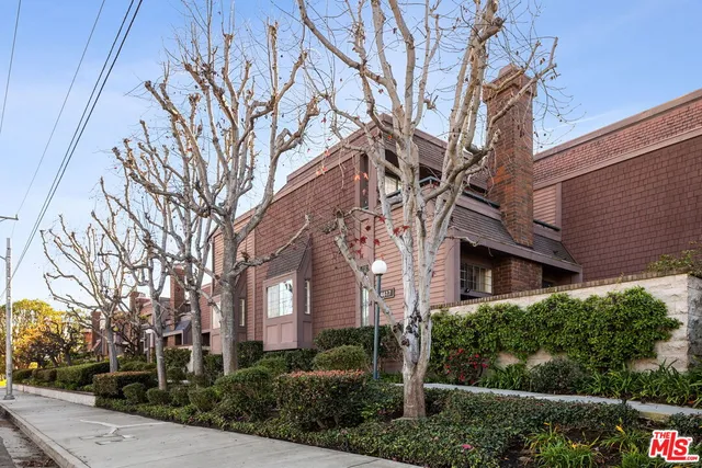 a view of a building with a yard