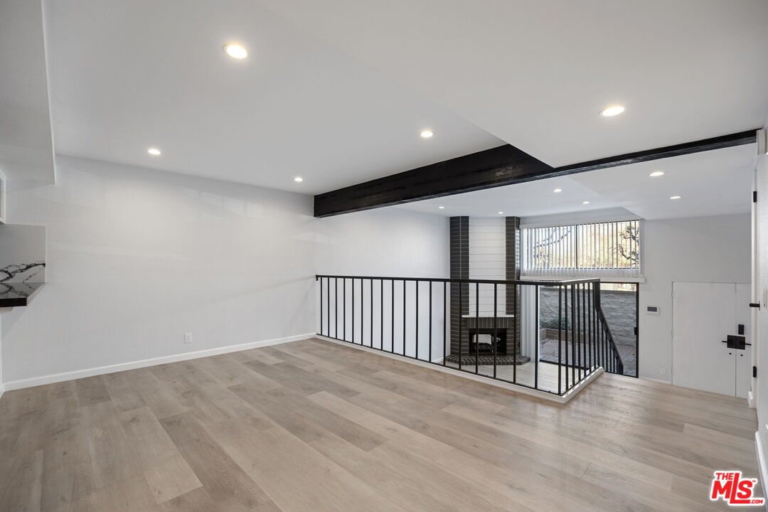 4631 Alla Road, Unit 8 Marina del Rey, CA 90292 - Photo 13 of 29 an empty room with wooden floor and windows