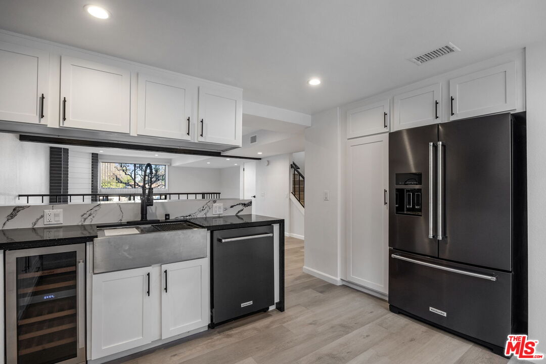 4631 Alla Road, Unit 8 Marina del Rey, CA 90292 - Photo 18 of 29 a kitchen with granite countertop a refrigerator stove and sink