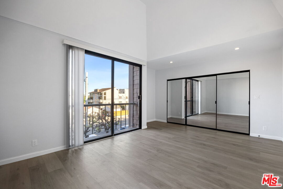 4631 Alla Road, Unit 8 Marina del Rey, CA 90292 - Photo 23 of 29 an empty room with wooden floor and windows