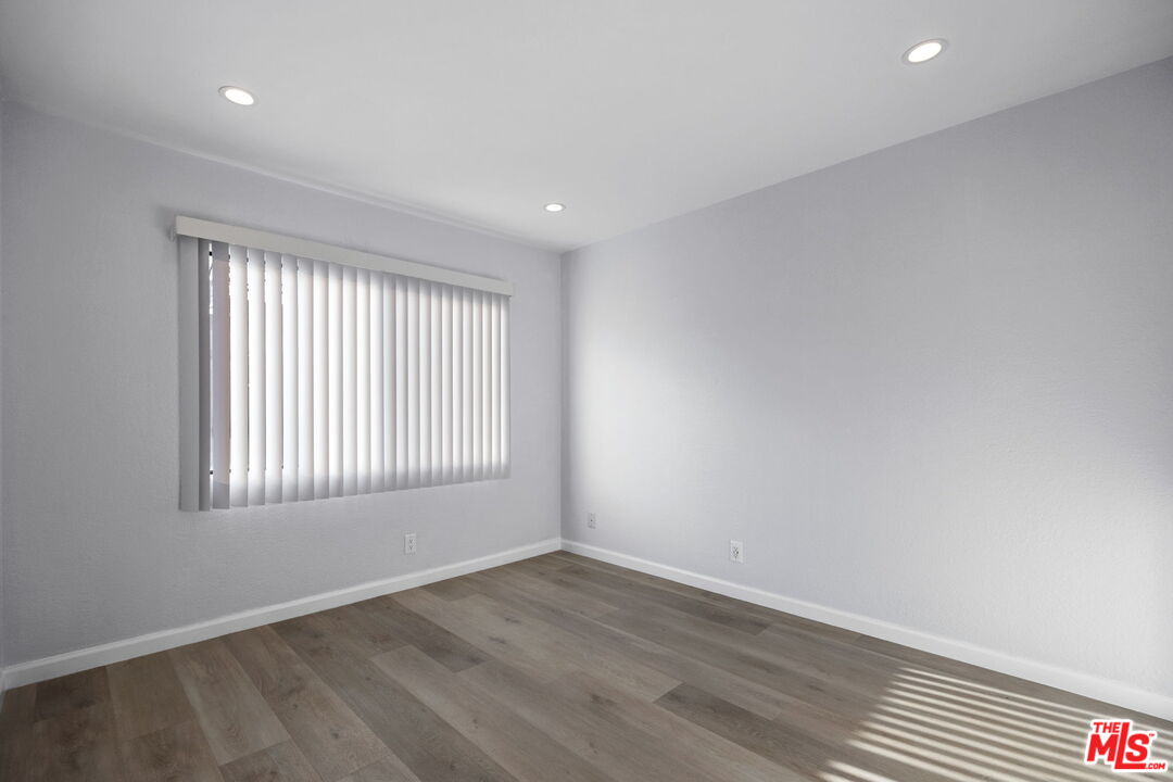 4631 Alla Road, Unit 8 Marina del Rey, CA 90292 - Photo 27 of 29 an empty room with wooden floor and windows