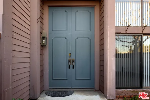 a view of a door and a window