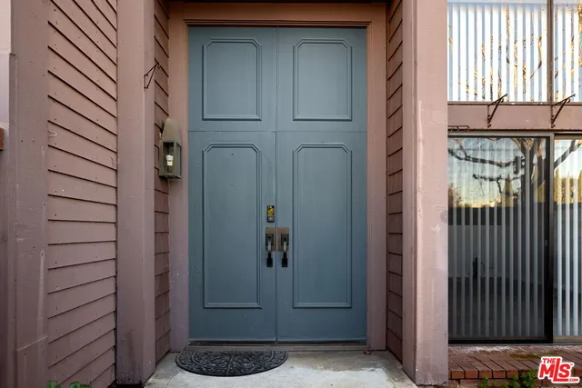 a view of a door and a window