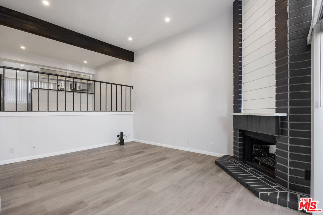 4631 Alla Road, Unit 8 Marina del Rey, CA 90292 - Photo 7 of 29 a view of an empty room with wooden floor and a window