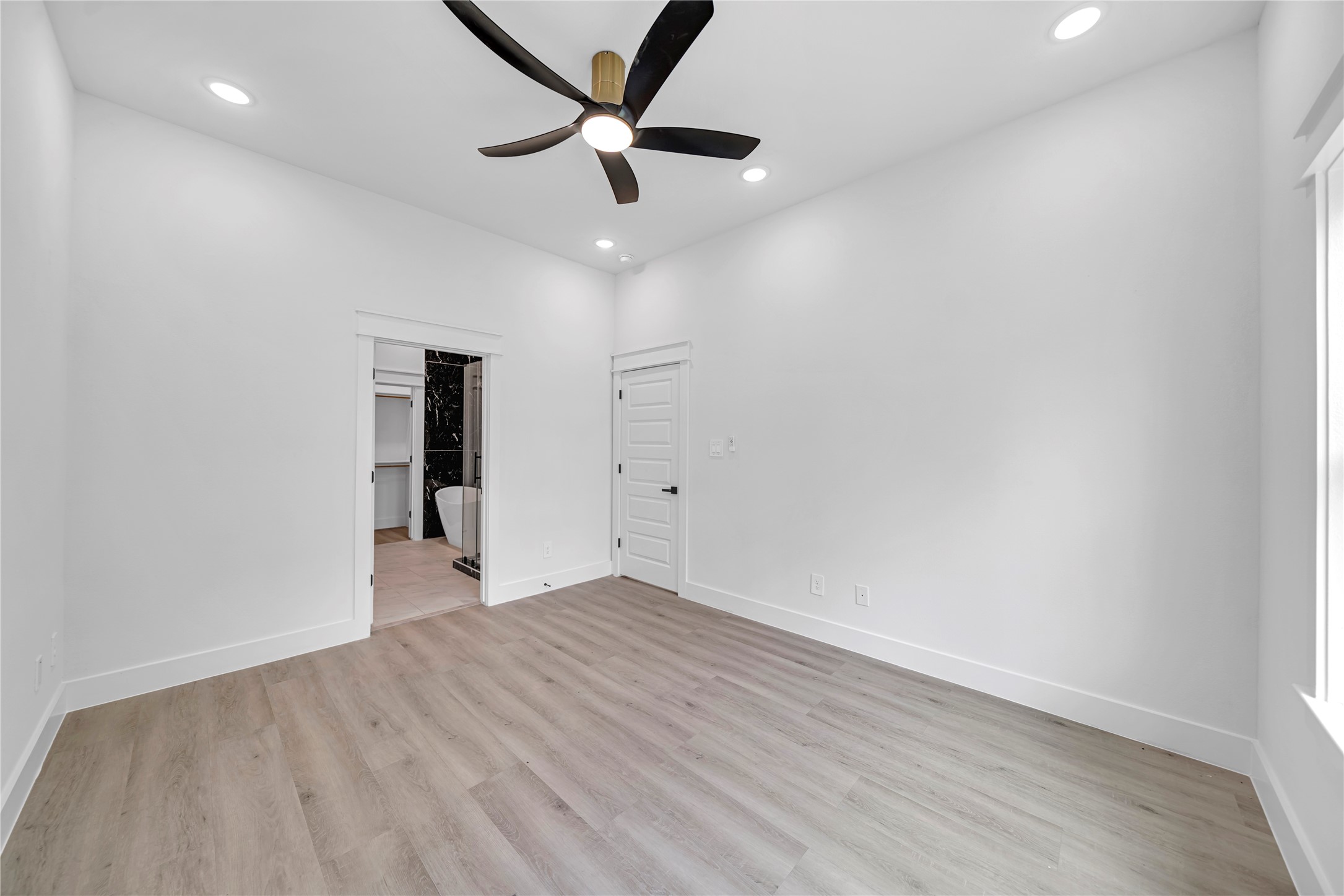 4834 Higgins Street, Unit B Houston, TX 77033 - Photo 11 of 34 wooden floor in an empty room