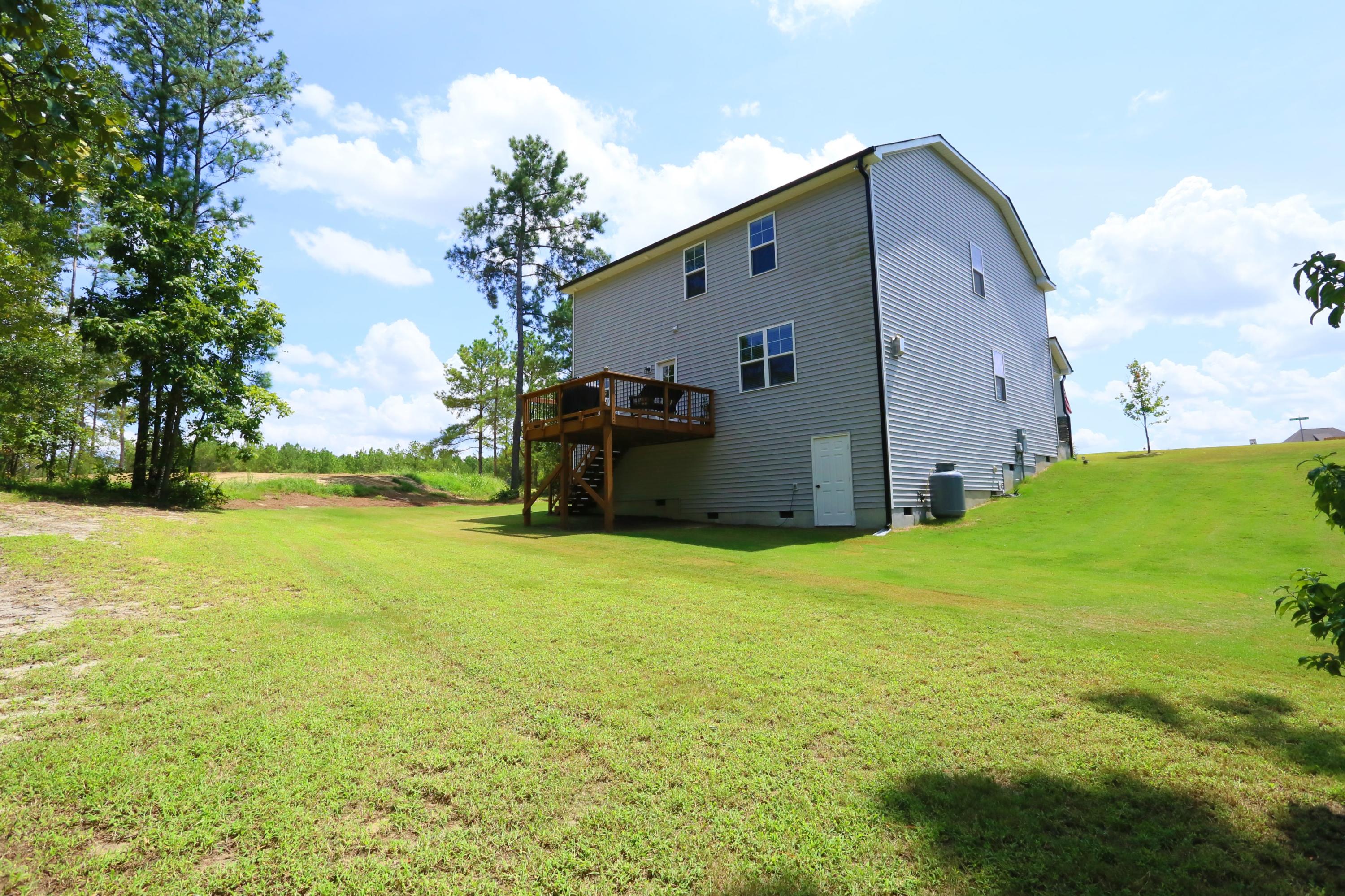 198 Sandy Springs Road Aberdeen, NC 28315 - Photo 25 of 27 Back with Crawl Space Entry