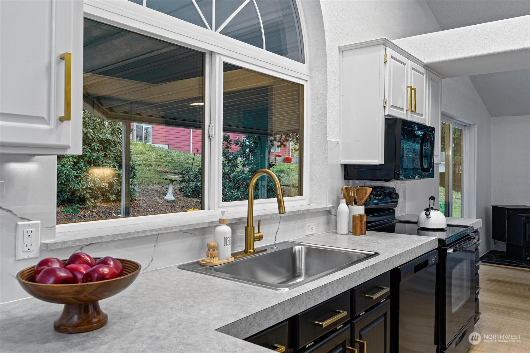 9601 South 198th Place Renton, WA 98055 - Photo 13 of 38 a kitchen with a sink and a microwave