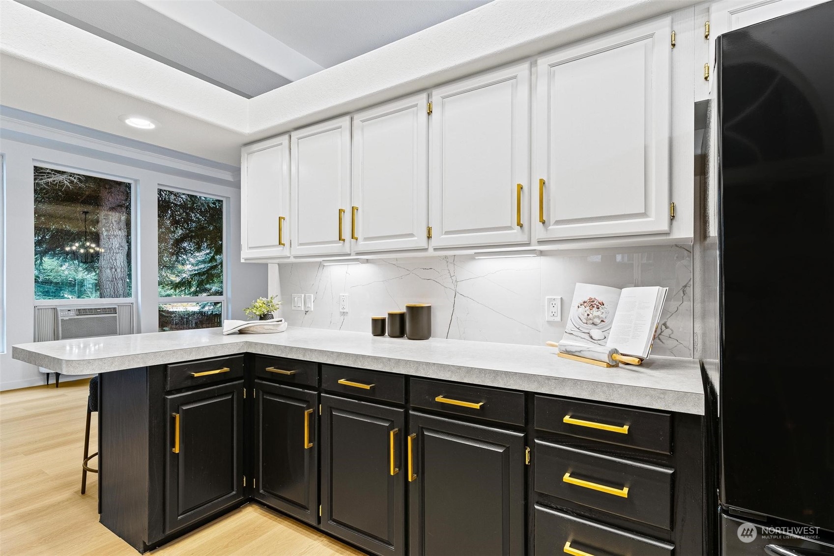 9601 South 198th Place Renton, WA 98055 - Photo 15 of 38 a kitchen with a sink window and cabinets