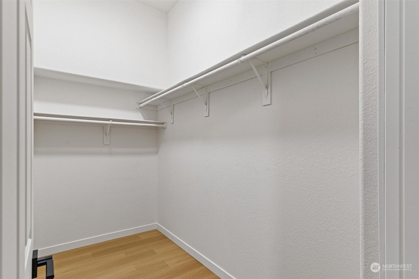 9601 South 198th Place Renton, WA 98055 - Photo 18 of 38 a view of a room with racks on the wall