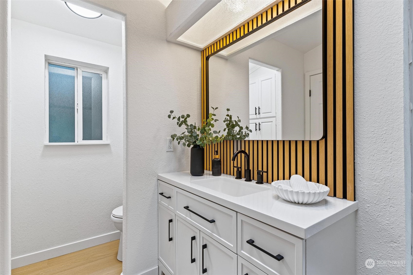 9601 South 198th Place Renton, WA 98055 - Photo 22 of 38 a bathroom with a sink and a mirror