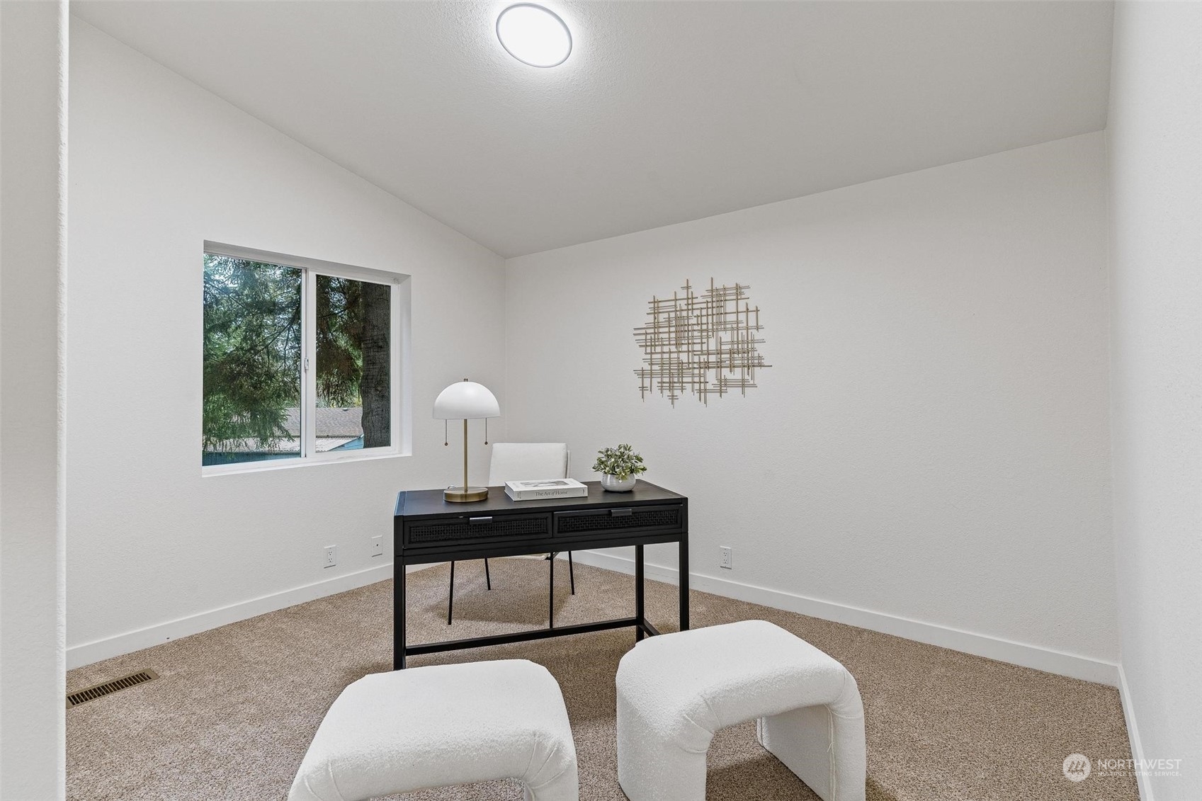 9601 South 198th Place Renton, WA 98055 - Photo 25 of 38 a view of a workspace with furniture and a window