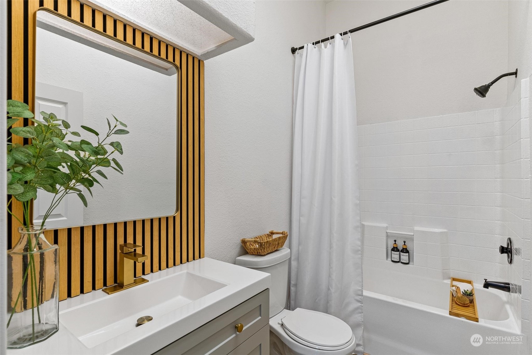 9601 South 198th Place Renton, WA 98055 - Photo 26 of 38 a bathroom with a sink a toilet and shower curtain