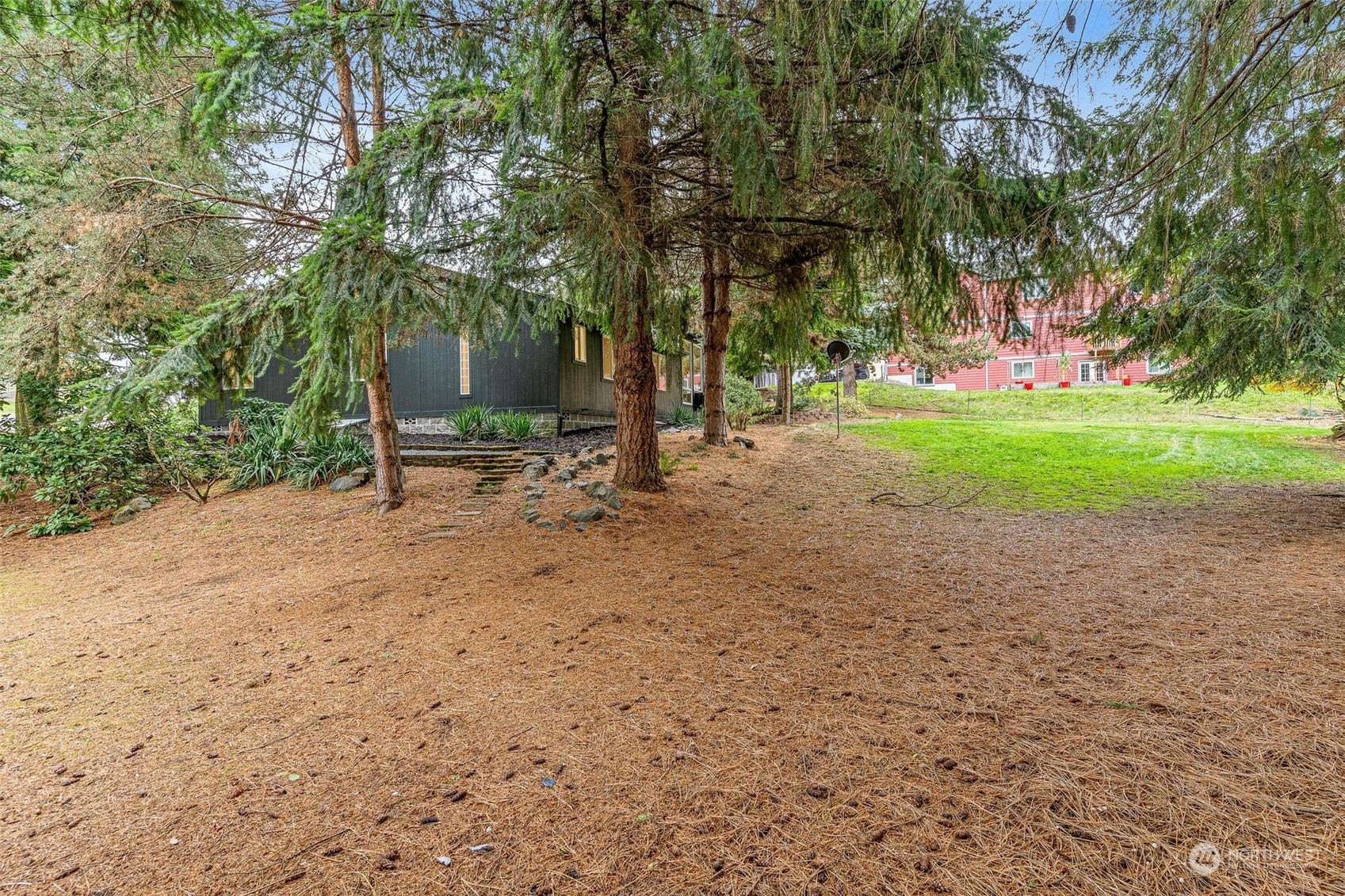 9601 South 198th Place Renton, WA 98055 - Photo 32 of 38 a backyard of a house with lots of green space