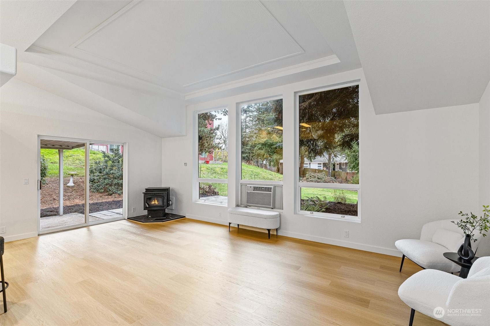 9601 South 198th Place Renton, WA 98055 - Photo 10 of 38 a view of an empty room with a window and wooden floor