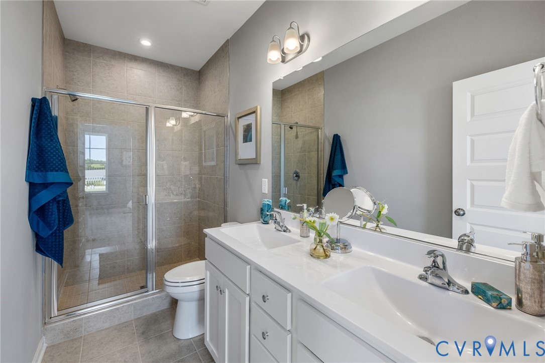 5408 Raysdale Road, Unit 101 Glen Allen, VA 23059 - Photo 18 of 39 a bathroom with a sink toilet and shower