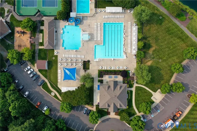 an aerial view of multiple houses with yard