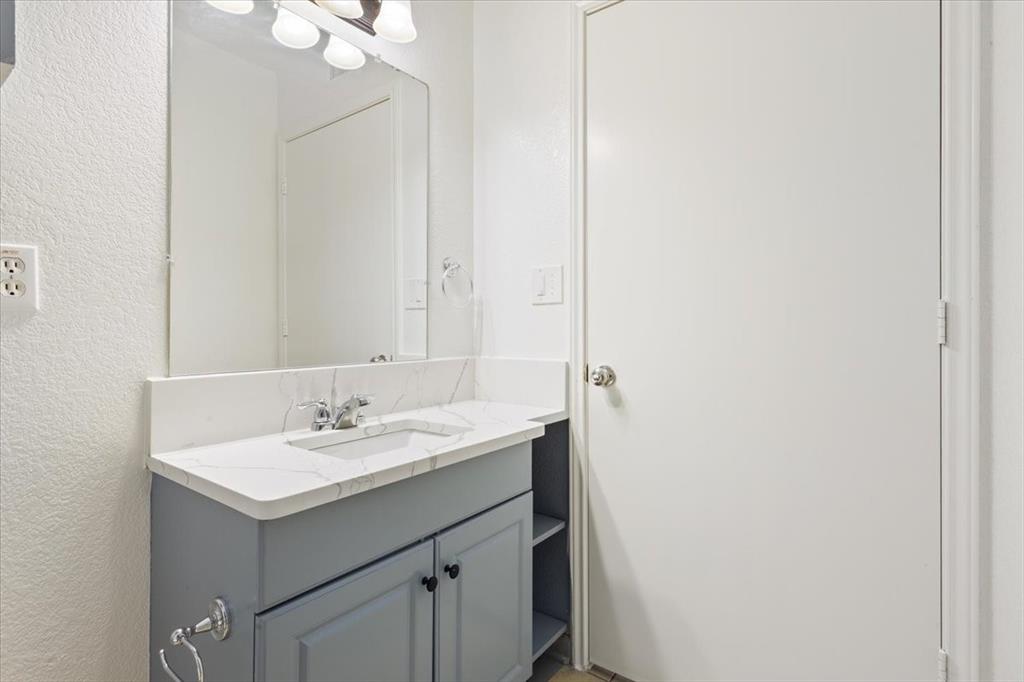 1120 Holt Avenue Waco, TX 76706 - Photo 15 of 25 a bathroom with a sink and a mirror