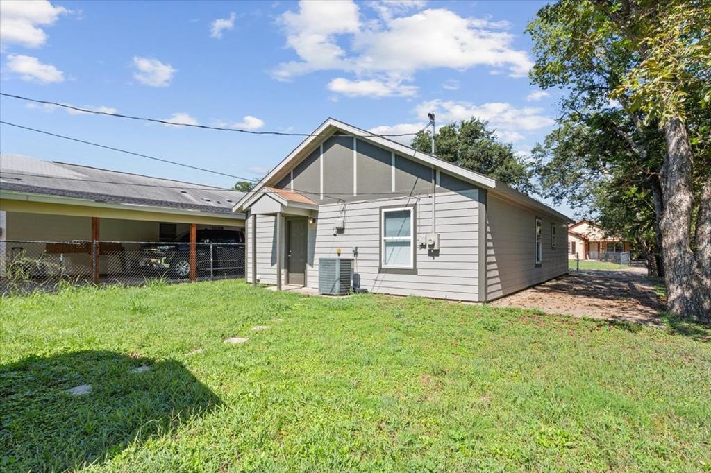 1120 Holt Avenue Waco, TX 76706 - Photo 23 of 25 a view of a house with a yard and potted plants