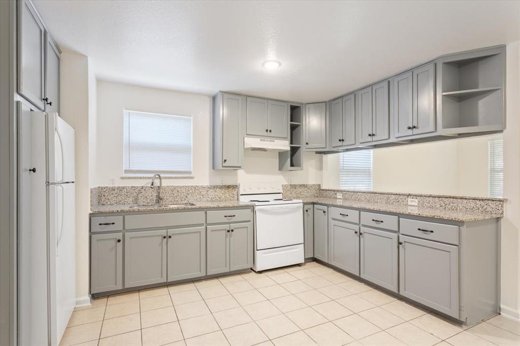 1120 Holt Avenue Waco, TX 76706 - Photo 9 of 25 a kitchen with cabinets appliances and a sink