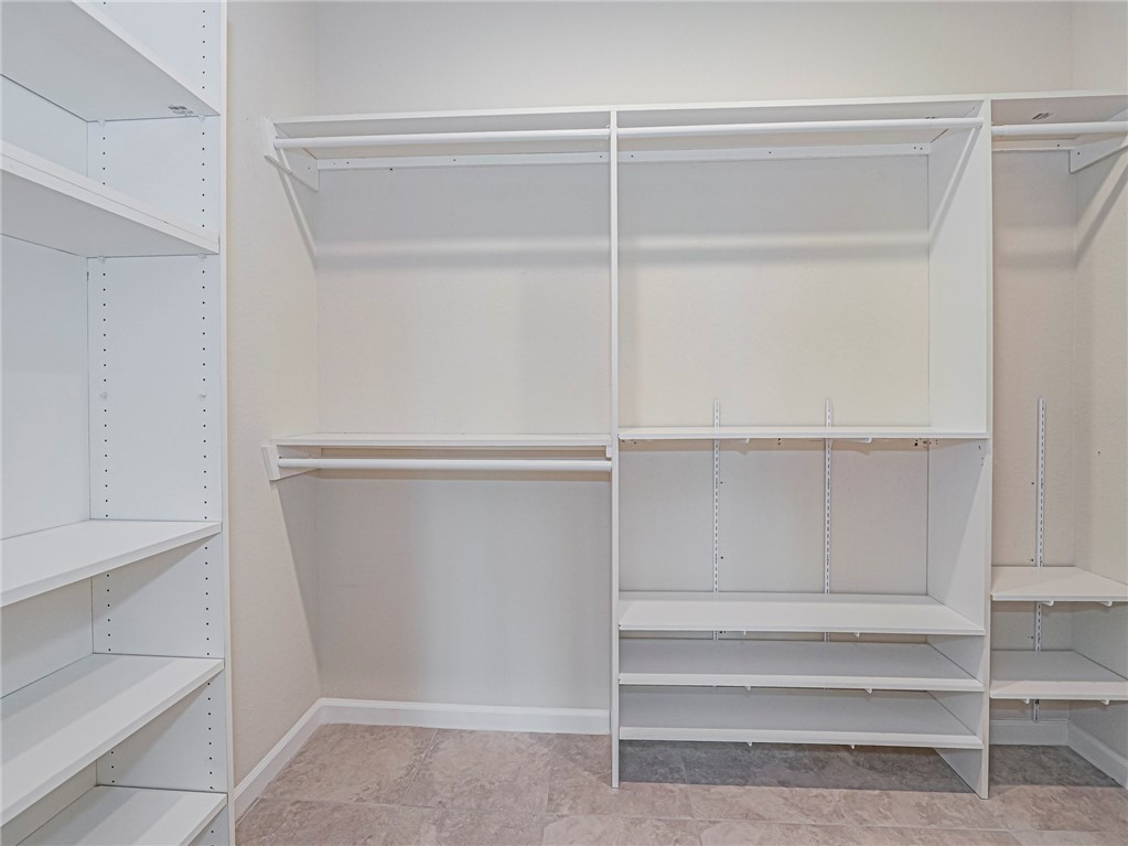 5190 Unity Square Vero Beach, FL 32967 - Photo 20 of 31 a view of walk in closet with empty racks