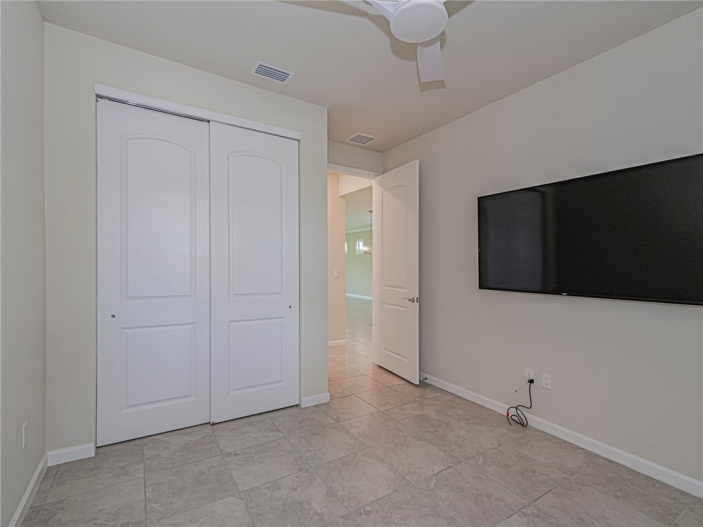 5190 Unity Square Vero Beach, FL 32967 - Photo 21 of 31 a view of an empty room with a tv