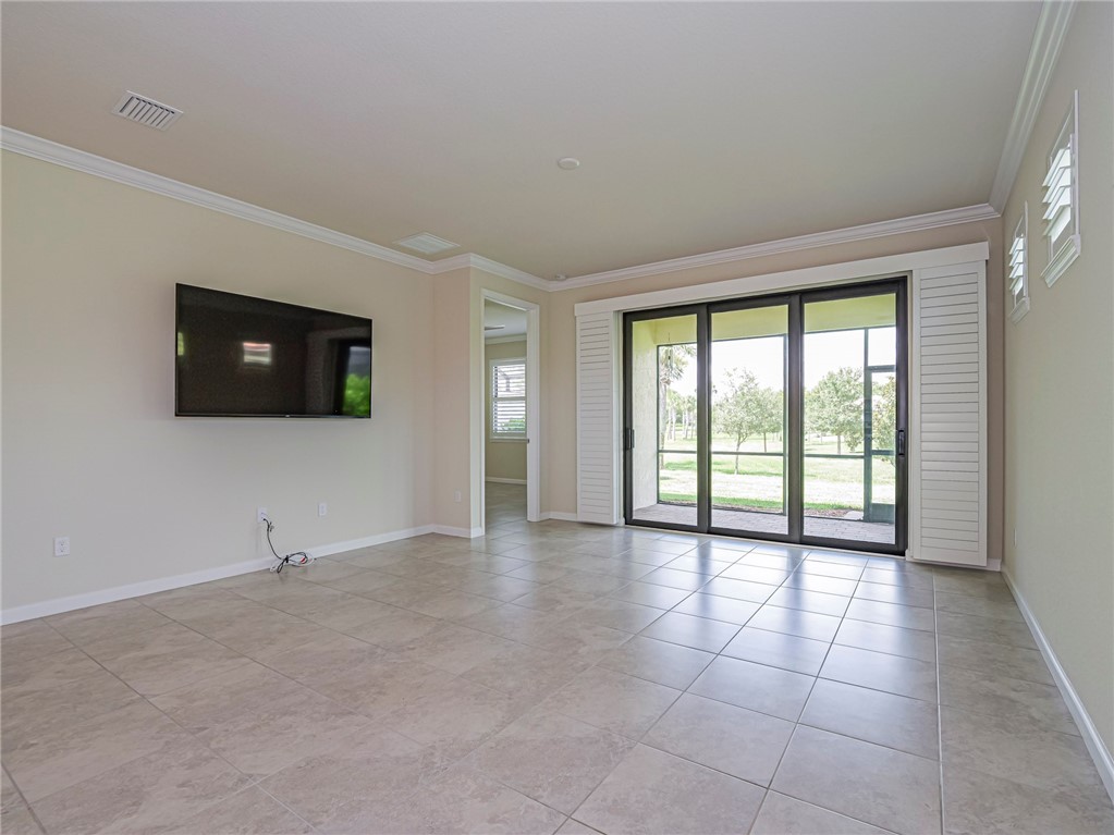 5190 Unity Square Vero Beach, FL 32967 - Photo 6 of 31 a view of an empty room with windows