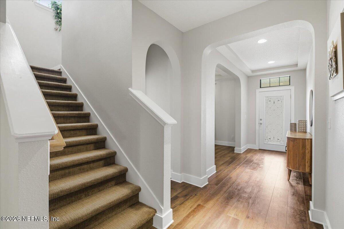 788 Reflection Cove Road East Jacksonville, FL 32218 - Photo 13 of 27 a view of a hallway with wooden floor and entryway