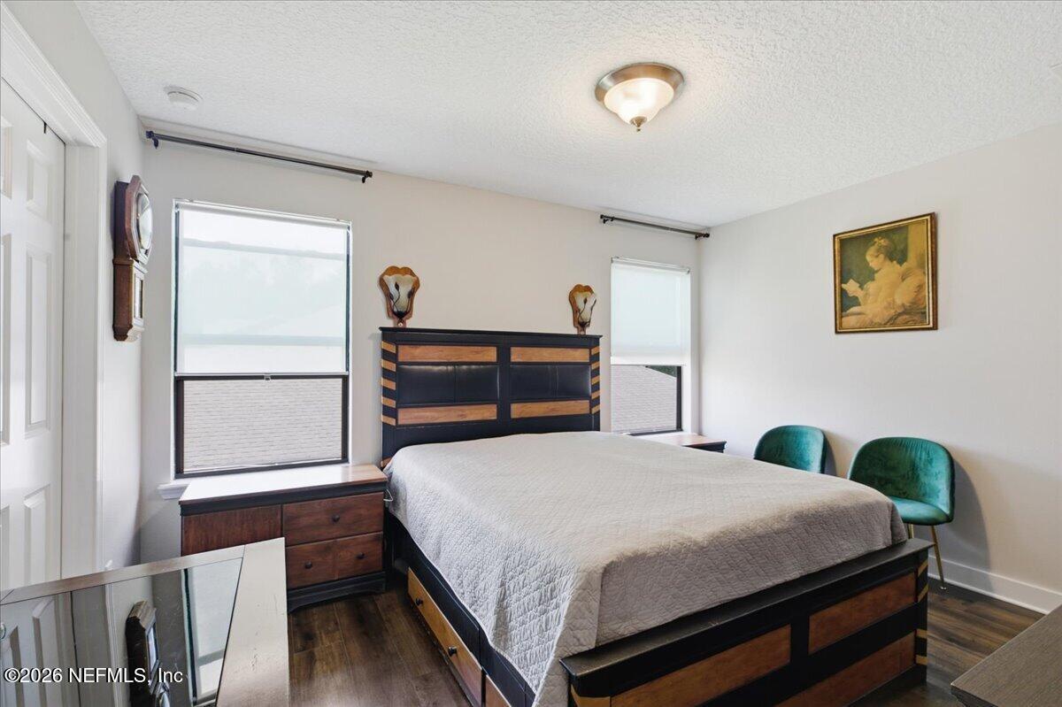 788 Reflection Cove Road East Jacksonville, FL 32218 - Photo 18 of 27 a bedroom with a bed and a painting on the wall