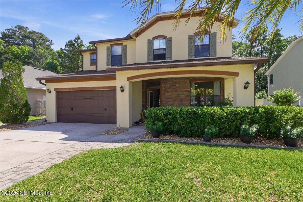 788 Reflection Cove Road East Jacksonville, FL 32218 - Photo 2 of 27 front view of a house with a yard