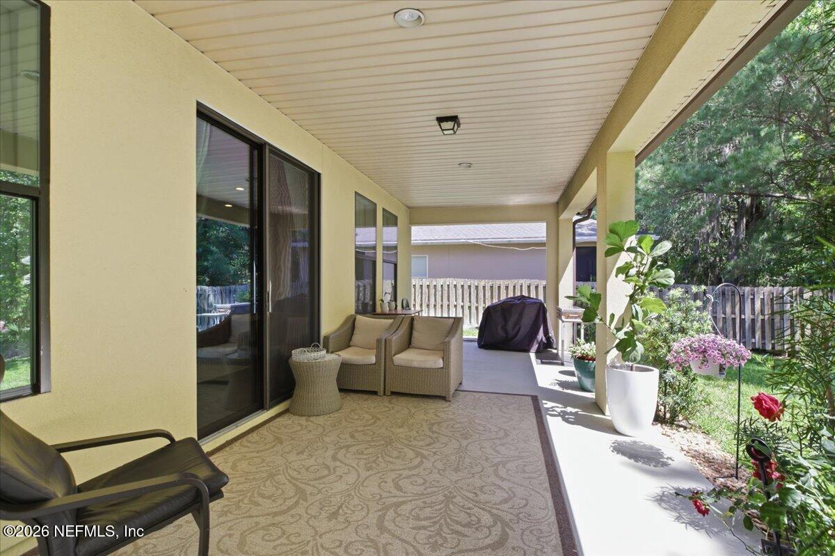 788 Reflection Cove Road East Jacksonville, FL 32218 - Photo 21 of 27 a lobby with furniture and potted plants