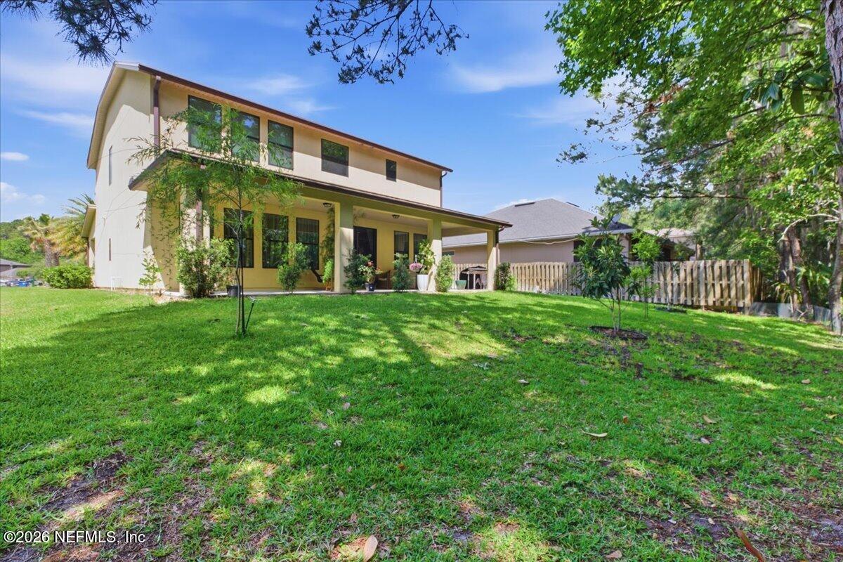 788 Reflection Cove Road East Jacksonville, FL 32218 - Photo 24 of 27 a front view of a building with a garden
