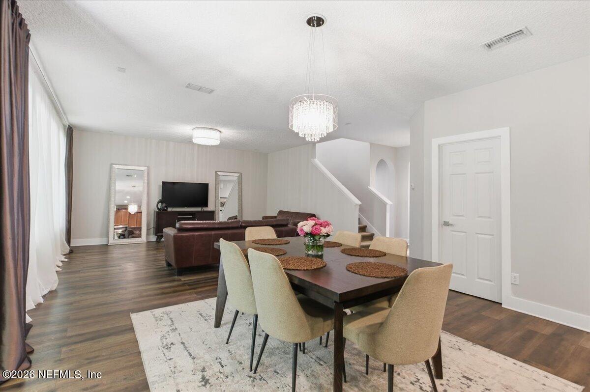 788 Reflection Cove Road East Jacksonville, FL 32218 - Photo 8 of 27 a view of a dining room with furniture