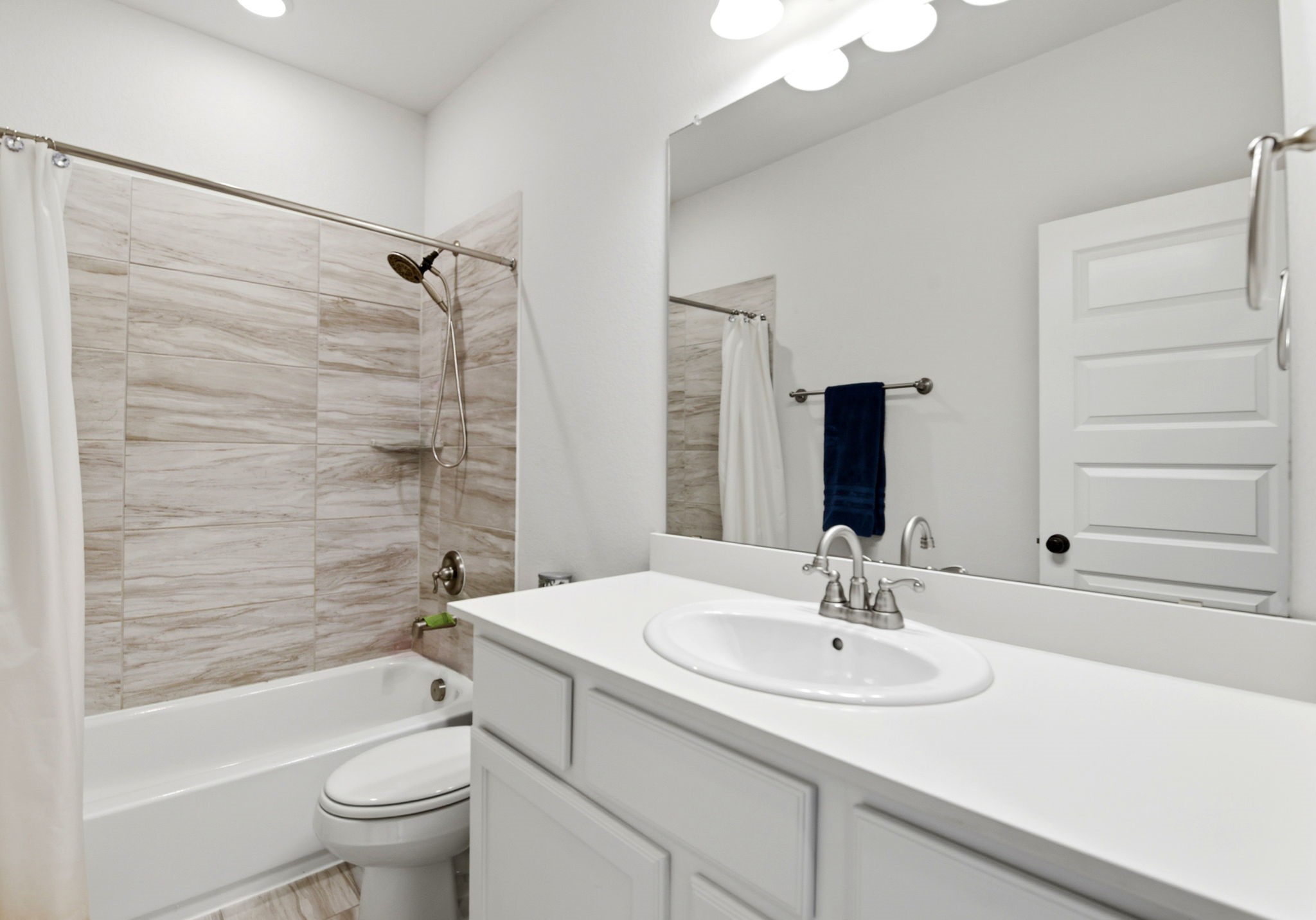 10062 South Goshawk Trail Conroe, TX 77385 - Photo 34 of 43 a bathroom with a sink toilet and shower