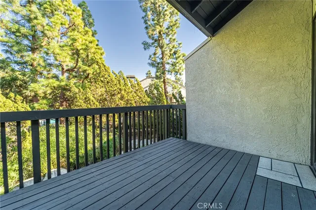 a view of balcony with wooden floor