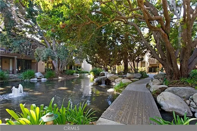 a view of a backyard with sitting area