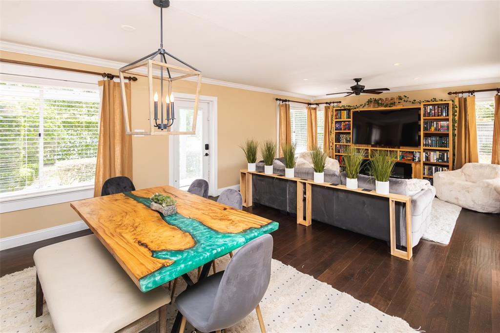 1001 Nottingham Street Orlando, FL 32803 - Photo 2 of 49 a bed room with furniture and a flat screen tv