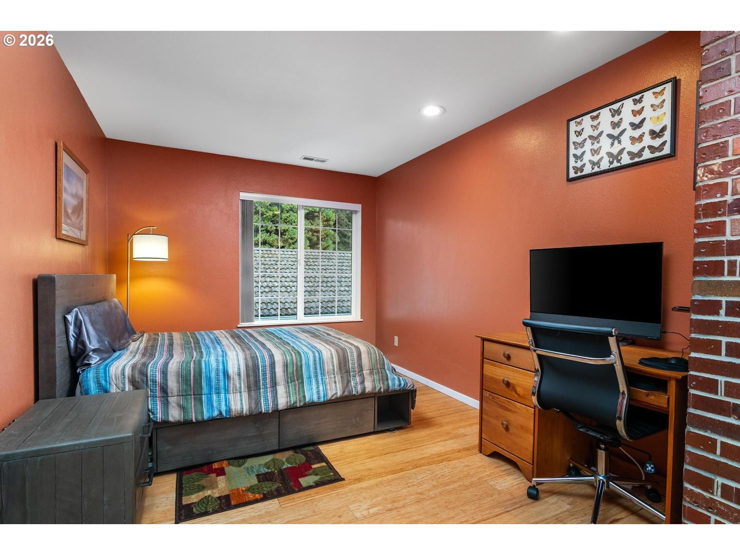 1840 Rees Hill Road Southeast, Unit 19 Salem, OR 97306 - Photo 18 of 34 a bed room with a bed television and a chair