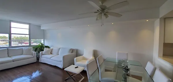 a kitchen with a sink appliances and cabinets