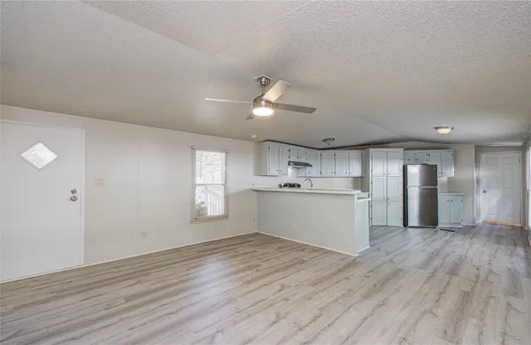 wooden floor in an empty room with a mirror