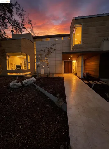 a view of an empty room with a fireplace