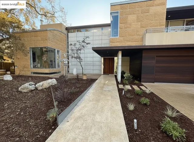 a front view of a house with barbeque grill